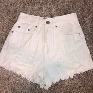 White ripped denim shorts